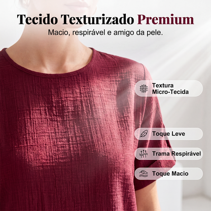 Conjunto de blusa com bainha assimétrica e calça de perna larga